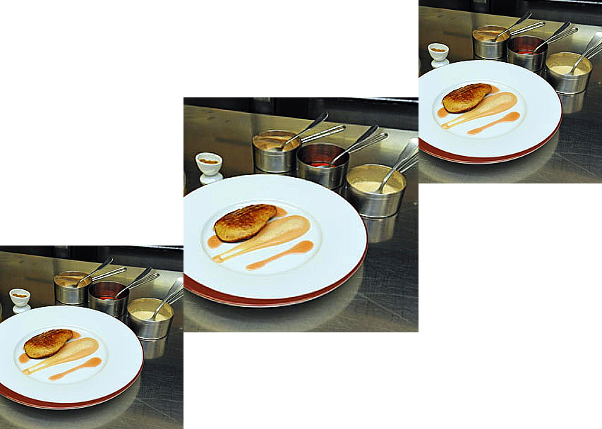 Assiette avec une tranche de foie gras poêlé accompagné d'une sauce coing/cumin